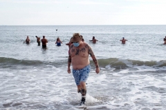 December 13,2020 Coney Island Polar Bear Club enjoys beautiful weather while people stroll the boardwalk and enjoy the sunny weather before the predicted snow storm to hit the East Coast on Wednesday.