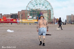 December 13,2020 Coney Island Polar Bear Club enjoys beautiful weather while people stroll the boardwalk and enjoy the sunny weather before the predicted snow storm to hit the East Coast on Wednesday.