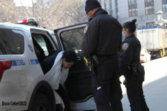 February 20, 2022  New York, 
Police Officers from the 1st precinct walk a suspect into the  Manhattan Criminal Courthouse for arraignment.