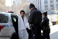 February 20, 2022  New York, 
Police Officers from the 1st precinct walk a suspect into the  Manhattan Criminal Courthouse for arraignment.