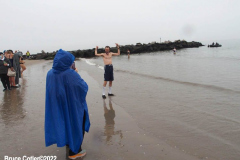 January 1, 2022  New York ,   Coney Island Polar Bear Plunge. This year the Polar Bear Plunge returned after last year's Covid  outbreak. Revelers enjoy the water.
Participant  prior to massive cardiac event and Emergency medical personnel try and revive him before transporting him to area hospital.