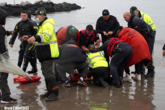 January 1, 2022  New York ,   Coney Island Polar Bear Plunge. This year the Polar Bear Plunge returned after last year's Covid  outbreak. Revelers enjoy the water.
Participant  prior to massive cardiac event and Emergency medical personnel try and revive him before transporting him to area hospital.