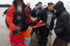 January 1, 2022  New York ,   Coney Island Polar Bear Plunge. This year the Polar Bear Plunge returned after last year's Covid  outbreak. Revelers enjoy the water.
Participant  prior to massive cardiac event and Emergency medical personnel try and revive him before transporting him to area hospital.