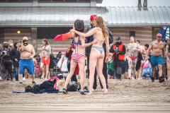 The Polar Bear Plunge commenced after a two year hiatus. An overcast and chilly day, spectators and participants took to the beach to keep on the ol’ tradition that kick starts many peoples’ year with a shock awakening of the senses. Brooklyn, NYC, NY. 01.01.22 (C) Bianca Otero