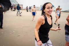 The Polar Bear Plunge commenced after a two year hiatus. An overcast and chilly day, spectators and participants took to the beach to keep on the ol’ tradition that kick starts many peoples’ year with a shock awakening of the senses. Brooklyn, NYC, NY. 01.01.22 (C) Bianca Otero