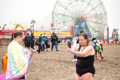 The Polar Bear Plunge commenced after a two year hiatus. An overcast and chilly day, spectators and participants took to the beach to keep on the ol’ tradition that kick starts many peoples’ year with a shock awakening of the senses. Brooklyn, NYC, NY. 01.01.22 (C) Bianca Otero