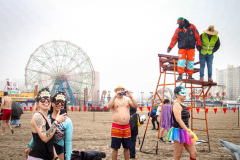 The Polar Bear Plunge commenced after a two year hiatus. An overcast and chilly day, spectators and participants took to the beach to keep on the ol’ tradition that kick starts many peoples’ year with a shock awakening of the senses. Brooklyn, NYC, NY. 01.01.22 (C) Bianca Otero