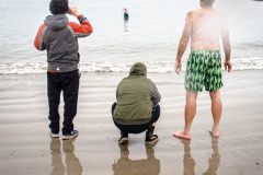 The Polar Bear Plunge commenced after a two year hiatus. An overcast and chilly day, spectators and participants took to the beach to keep on the ol’ tradition that kick starts many peoples’ year with a shock awakening of the senses. Brooklyn, NYC, NY. 01.01.22 (C) Bianca Otero