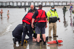 The Polar Bear Plunge commenced after a two year hiatus. An overcast and chilly day, spectators and participants took to the beach to keep on the ol’ tradition that kick starts many peoples’ year with a shock awakening of the senses. Brooklyn, NYC, NY. 01.01.22 (C) Bianca Otero