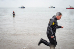 The Polar Bear Plunge commenced after a two year hiatus. An overcast and chilly day, spectators and participants took to the beach to keep on the ol’ tradition that kick starts many peoples’ year with a shock awakening of the senses. Brooklyn, NYC, NY. 01.01.22 (C) Bianca Otero