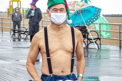 The Polar Bear Plunge commenced after a two year hiatus. An overcast and chilly day, spectators and participants took to the beach to keep on the ol’ tradition that kick starts many peoples’ year with a shock awakening of the senses. Brooklyn, NYC, NY. 01.01.22 (C) Bianca Otero