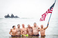 The Polar Bear Plunge commenced after a two year hiatus. An overcast and chilly day, spectators and participants took to the beach to keep on the ol’ tradition that kick starts many peoples’ year with a shock awakening of the senses. Brooklyn, NYC, NY. 01.01.22 (C) Bianca Otero
