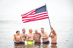 The Polar Bear Plunge commenced after a two year hiatus. An overcast and chilly day, spectators and participants took to the beach to keep on the ol’ tradition that kick starts many peoples’ year with a shock awakening of the senses. Brooklyn, NYC, NY. 01.01.22 (C) Bianca Otero