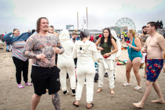 The Polar Bear Plunge commenced after a two year hiatus. An overcast and chilly day, spectators and participants took to the beach to keep on the ol’ tradition that kick starts many peoples’ year with a shock awakening of the senses. Brooklyn, NYC, NY. 01.01.22 (C) Bianca Otero