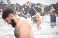 The Polar Bear Plunge commenced after a two year hiatus. An overcast and chilly day, spectators and participants took to the beach to keep on the ol’ tradition that kick starts many peoples’ year with a shock awakening of the senses. Brooklyn, NYC, NY. 01.01.22 (C) Bianca Otero