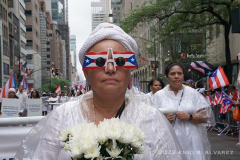 Elizabeth Figueroa marches with the Silent Procession/NYC4PR don 5th Avenue during the 65 National Puerto Rican Day Parade is celebrated by thousands who marched and cheered on along 5th avenue in Manhattan New York on Sunday, June 12, 2022 The 2022 Parade was dedicated to the municipality of Cidra, Puerto Rico. Known as the Pueblo de la Eterna Primavera (Town of Eternal Spring), Cidra is located in the central, mountainous region of the island.

Photography by Enid B. Alvarez