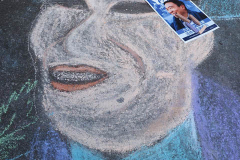 An Andrew Yang supporter drew a picture of him on the street at a Pre-Debate Rally for the final Mayoral debate before Election Day outside 30 Rockefeller Center in New York City