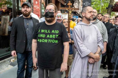 A pro-abortion supporter  stands next to pro-life-supporters on July 2, 2022, in New York, NY. (Photo by Gabriele Holtermann/Sipa USA)