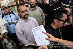 A pro-choice activist hands a flyer to a pro-life supporter on July 2, 2022, in New York, NY. (Photo by Gabriele Holtermann/Sipa USA)