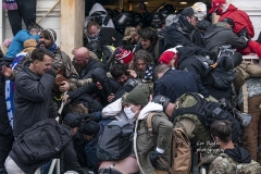 Washington, DC - January 6, 2021: Pro-Trump protesters confront police during rally around at Capitol building