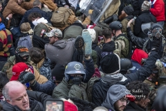 Washington, DC - January 6, 2021: Rioters clash with police trying to enter Capitol building through the front doors