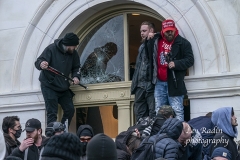 Washington, DC - January 6, 2021: Pro-Trump protesters seen inside Capitol building as they enter in through broken windows