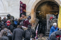 Washington, DC - January 6, 2021: Police defend Capitol building against Pro-Trump protesters by using papper spray