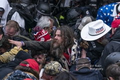 Washington, DC - January 6, 2021: Pro-Trump protester injured by tear gas during rally around at Capitol building when they tried to break in through front doors