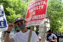 Member of the Professional Staff Congress the  college union that represents professors and college staff, protest in front of New York's City Hall.