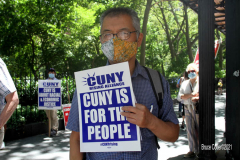 Member of the Professional Staff Congress the  college union that represents professors and college staff, protest in front of New York's City Hall.
