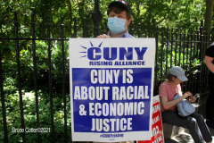 Member of the Professional Staff Congress the  college union that represents professors and college staff, protest in front of New York's City Hall.