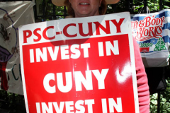 Member of the Professional Staff Congress the  college union that represents professors and college staff, protest in front of New York's City Hall.