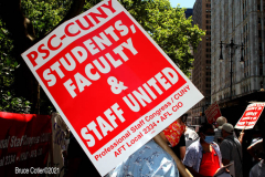 Member of the Professional Staff Congress the  college union that represents professors and college staff, protest in front of New York's City Hall.