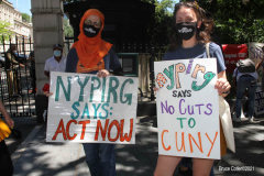 Member of the Professional Staff Congress the  college union that represents professors and college staff, protest in front of New York's City Hall.