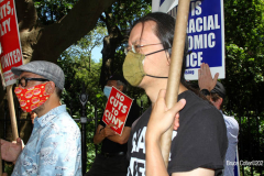 Member of the Professional Staff Congress the  college union that represents professors and college staff, protest in front of New York's City Hall.