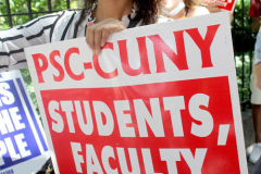 Member of the Professional Staff Congress the  college union that represents professors and college staff, protest in front of New York's City Hall.