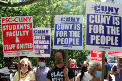 Member of the Professional Staff Congress the  college union that represents professors and college staff, protest in front of New York's City Hall.