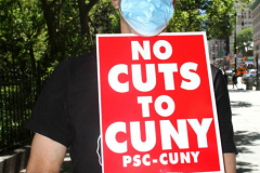 Member of the Professional Staff Congress the  college union that represents professors and college staff, protest in front of New York's City Hall.