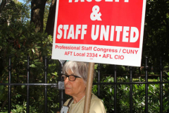 Member of the Professional Staff Congress the  college union that represents professors and college staff, protest in front of New York's City Hall.