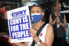 Member of the Professional Staff Congress the  college union that represents professors and college staff, protest in front of New York's City Hall.