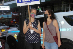 Member of the Professional Staff Congress the  college union that represents professors and college staff, protest in front of New York's City Hall.