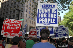 Member of the Professional Staff Congress the  college union that represents professors and college staff, protest in front of New York's City Hall.