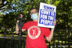 Member of the Professional Staff Congress the  college union that represents professors and college staff, protest in front of New York's City Hall.