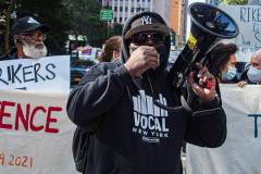 An activist speaks to the crowd during a protest against Rikers Island Prison and facilities in front of City Hall, NYC, October 1, 2021.
On September 22, 2021 the death of Stephan Khadu, 24, just a few days after Abdul Karim, became the 12th inmate to die at Rikers Island Prison in 2021. After various inquiries and investigations, activist groups such as:  Women Prison Coalition, HALT Solitary Confinement, Vocal New York and Jails Action Coalition  organized the protest to gather former inmates, family and supporters together, to demand answers from local authorities and political figures regarding the system of prison management, process of bail and incarceration of people who inevitably find themselves in prison without a conviction. 
The protest moved from City Hall onto a Broadway intersection and blocked traffic up to a half a mile long for almost an hour. 
(C) Bianca Otero, October 1, 2021