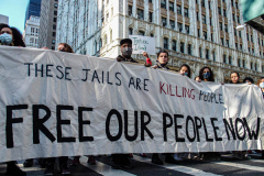 Demonstrators during a protest against Rikers Island Prison and facilities in front of City Hall, NYC, October 1, 2021.
On September 22, 2021 the death of Stephan Khadu, 24, just a few days after Abdul Karim, became the 12th inmate to die at Rikers Island Prison in 2021. After various inquiries and investigations, activist groups such as:  Women Prison Coalition, HALT Solitary Confinement, Vocal New York and Jails Action Coalition  organized the protest to gather former inmates, family and supporters together, to demand answers from local authorities and political figures regarding the system of prison management, process of bail and incarceration of people who inevitably find themselves in prison without a conviction. 
The protest moved from City Hall onto a Broadway intersection and blocked traffic up to a half a mile long for almost an hour. 
(C) Bianca Otero, October 1, 2021