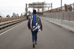 New York,  12,000 N.Y.C.  Municipal employees (police,fire,sanitation,teachers) protest  the  
Mandate to get vaccinated by October 29, 2021 or be put on unpaid leave. The protesters walked across the Brooklyn Bridge to City Hall.