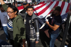 New York,  12,000 N.Y.C.  Municipal employees (police,fire,sanitation,teachers) protest  the  
Mandate to get vaccinated by October 29, 2021 or be put on unpaid leave. The protesters walked across the Brooklyn Bridge to City Hall.