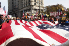 New York,  12,000 N.Y.C.  Municipal employees (police,fire,sanitation,teachers) protest  the  
Mandate to get vaccinated by October 29, 2021 or be put on unpaid leave. The protesters walked across the Brooklyn Bridge to City Hall.