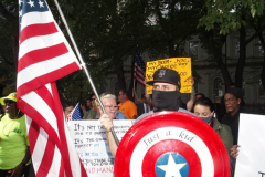 New York,  12,000 N.Y.C.  Municipal employees (police,fire,sanitation,teachers) protest  the  
Mandate to get vaccinated by October 29, 2021 or be put on unpaid leave. The protesters walked across the Brooklyn Bridge to City Hall.