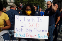 New York,  12,000 N.Y.C.  Municipal employees (police,fire,sanitation,teachers) protest  the  
Mandate to get vaccinated by October 29, 2021 or be put on unpaid leave. The protesters walked across the Brooklyn Bridge to City Hall.